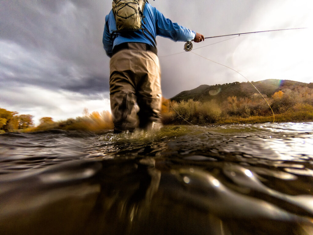 Flyfisher in stream